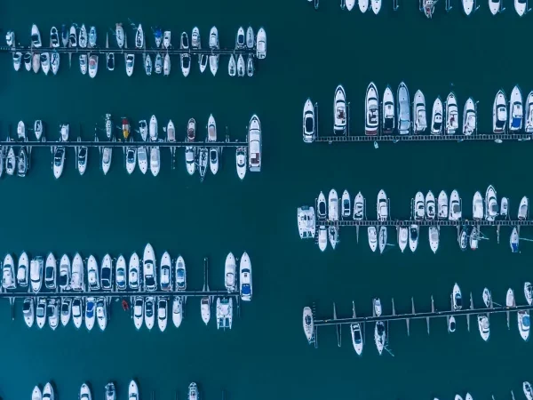 Image taken from above showing many boats in a harbour